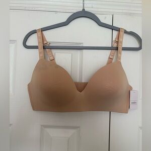 Tan Auden bra size 38D. Stain in the upper corner, but unworn.